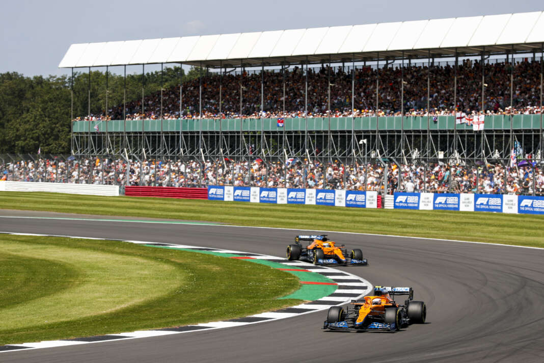 Lando Norris, McLaren MCL35M, leads Daniel Ricciardo, Silverstone