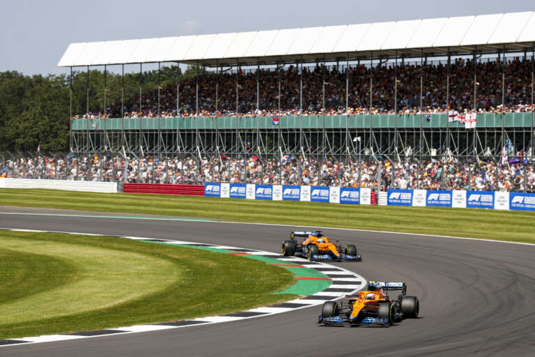 Lando Norris, McLaren MCL35M, leads Daniel Ricciardo, Silverstone