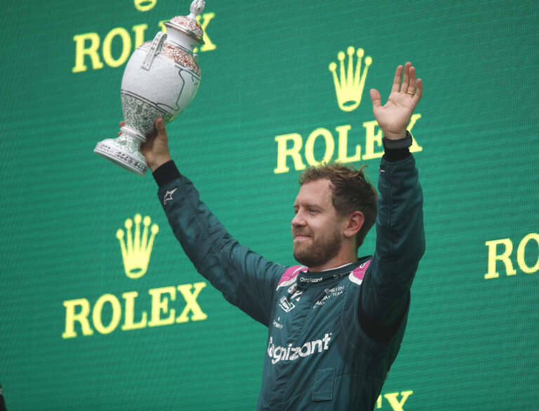 Sebastian Vettel, Aston Martin, 2nd position, with his trophy